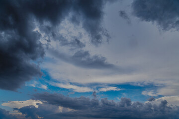 Obraz premium Rainclouds cover the blue sky