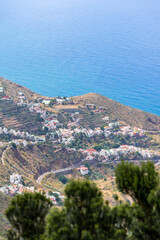 Obraz premium The Anaga massif (Macizo de Anaga). Natural landscape of the north of Tenerife and the small town of Taganana. Canary Islands. Spain. View from the observation deck - Mirador Bailadero.