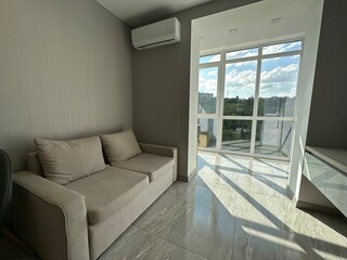 modern living room with beige sofa