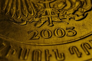 an extremely close up shot of a metal object with gold foil on it