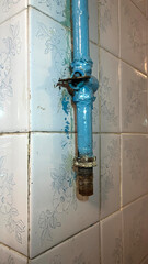 Element of a gas pipe on wall background