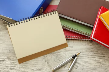Fotobehang spiral notepad, fountain pen, copy space, horizontal, top view © Svetlana
