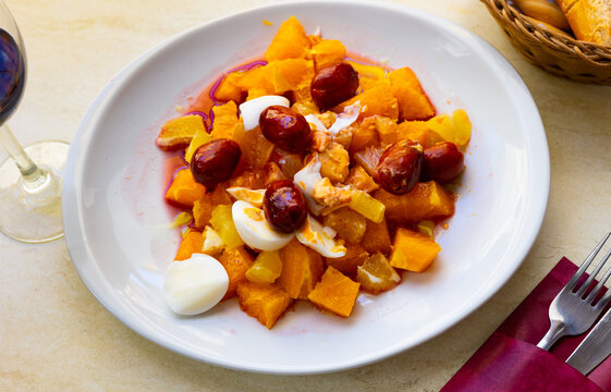 Delicious salad with orange, boiled eggs and kalamata olives, traditional dish of Malaga, Spain