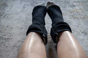 woman wears battery powered heated socks for cold winter