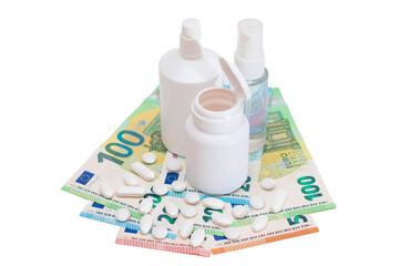 Different Bottles with Pills, Capsules and Medicines on the Euro Banknotes - Isolated on White. Global Pharmaceutical Industry and Big Pharma. Euro Money Bills - Isolation