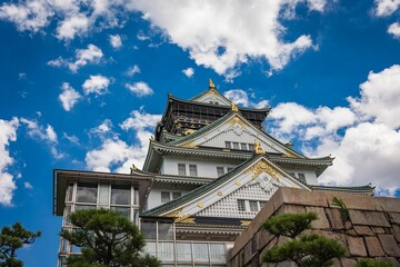 Osaka castle angle view in summer with dramatic sky background