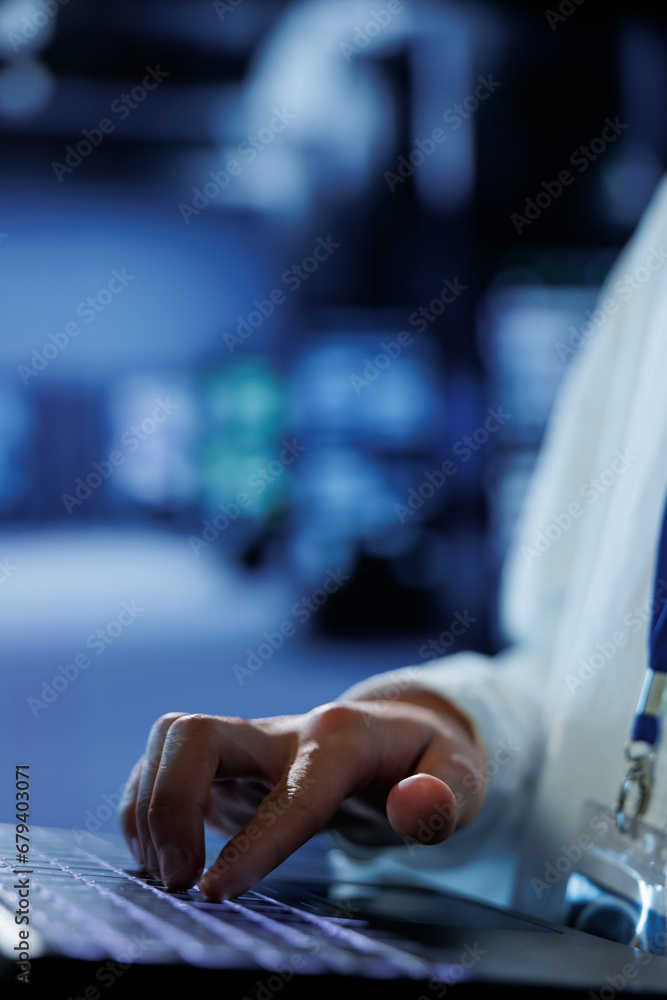 Poster knowledgeable admin in data center uses laptop to prevent system overload during peak traffic period