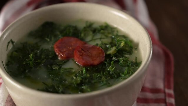 Caldo verde popular soup in Portuguese cuisine. traditional ingredients for caldo verde are potatoes, collard greens , olive oil and salt. Additionally garlic or onion may be added.
