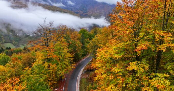 Majestic autumnal view of a Thethi national park in Albania and the mountain road passing through it. 