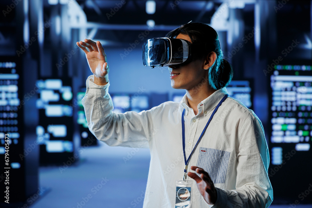 Poster admin in data center uses virtual reality to prevent system overload during peak traffic periods. ma