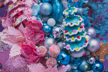 This stunning Christmas tree, adorned in shades of blue and pink, is a mesmerizing sight. It sparkles with festive charm, creating a magical holiday atmosphere.