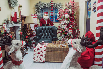  A colorful, joyful scene adorned with a Santa statue, plush sofa, and charming stuffed animals....
