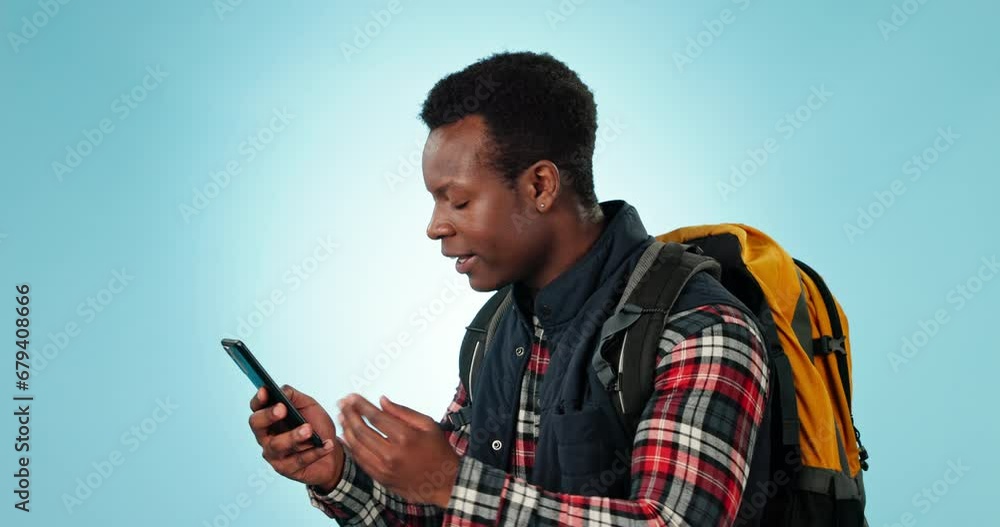 Poster Phone, fail and angry black man in studio with travel, stress or location problem while hiking on blue background. Smartphone, criss and African male backpacker frustrated by 404, glitch or app error