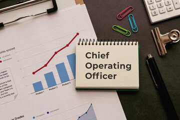 There is notebook with the word Chief Operating Officer. It is as an eye-catching image.