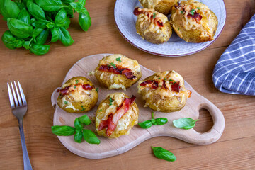 Baked potatoes with bacon and mozzarella