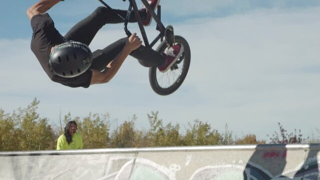 BMX Rider Performs aerial trick in slow motion