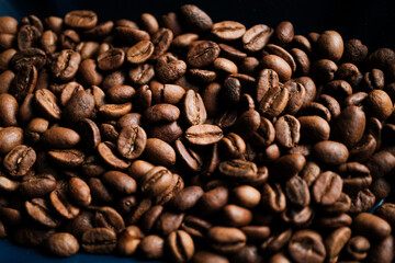 Roasted coffee beans with a well-lit macro shot