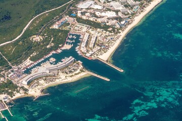 Cancun, Quintana Roo, Mexico - October 31, 2022: Aerial view of Puerto Amada, the Paradisus Playa Mujeres Hotel, La Amada Residences, the Beloved Playa Mujeres, Punta Och Zona Faro and the yacht basin - obrazy, fototapety, plakaty