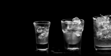 Close up of glass with ice cube as refreshing drink during summer