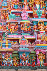 Fototapeta na wymiar Sculptures on Hindu temple gopura (tower). Menakshi Temple, Madurai, Tamil Nadu, India