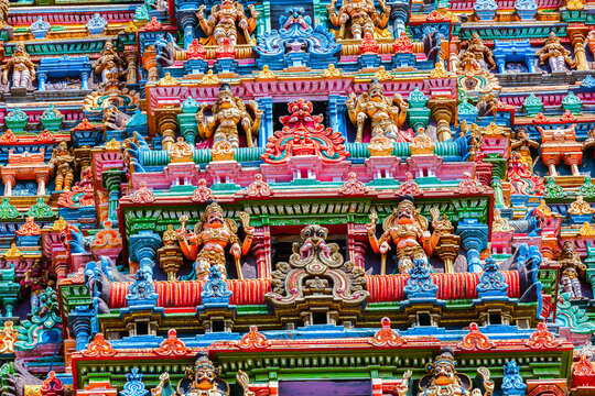 Sculptures on Hindu temple gopura tower. Meenakshi Temple, Madurai, Tamil Nadu, India