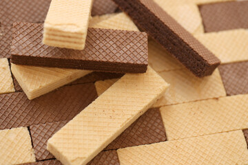 Stacked delicious chocolate wafers in large amount. Two different flavours of classic small waffles
