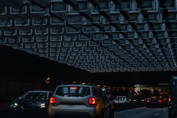 Driving in tunnel in heavy traffic on ring road of capital of France, traffic jam problems in Paris