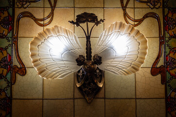 Art deco colorful floral styled decoration on walls, cellar and lights in traditional French cafe bouillon
