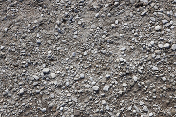 Background of shattered stony stones surface in mountain area. Flat texture with natural light