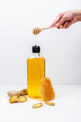 Shower gel with the aroma of honey and ginger. Shampoo on a white background. Mockup.
