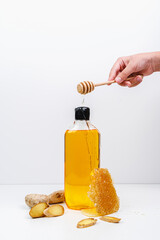 Shower gel with the aroma of honey and ginger. Shampoo on a white background. Mockup.
