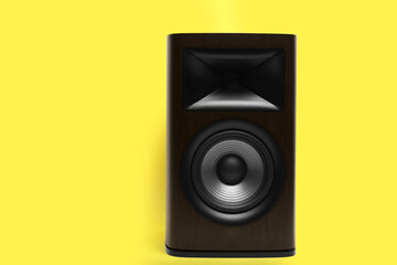 One wooden sound speaker on yellow background. Space for text