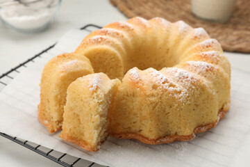 Delicious freshly baked sponge cake on table, closeup