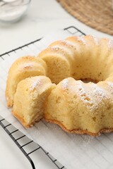 Delicious freshly baked sponge cake on table, closeup