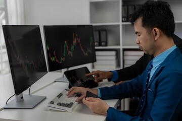 Forex traders Man in front of multiple computer monitors Automated computer monitor of business processes from financial stock analysis data graphs.