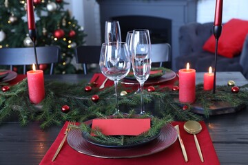 Elegant Christmas table setting with blank place card and festive decor