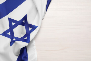 Flag of Israel on white wooden background, top view and space for text. National symbol