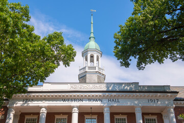 Weston Town Hall at Lanson Park in summer in historic town center of Weston, Massachusetts MA, USA....