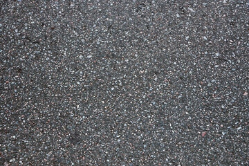 Surface grunge rough of asphalt. Tarmac dark grey grainy road. Texture Background Top view close up
