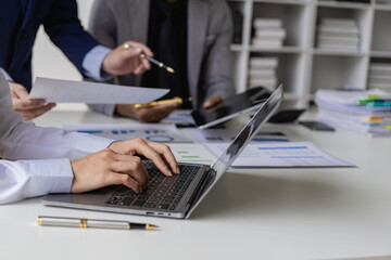 Businessmen discuss charts and graphs showing the results of successful teamwork. Business meeting closed to discuss market situation Business finance concept, close-up image