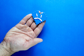 Blue Monday Concept. Hands of a man holding a blue heart.