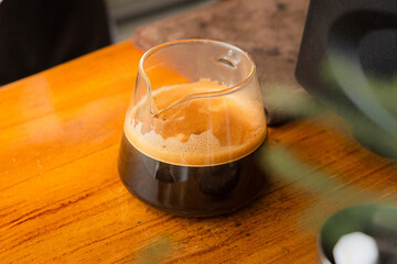 making a big shot of espresso at the coffee shop. a cup of espresso coffee