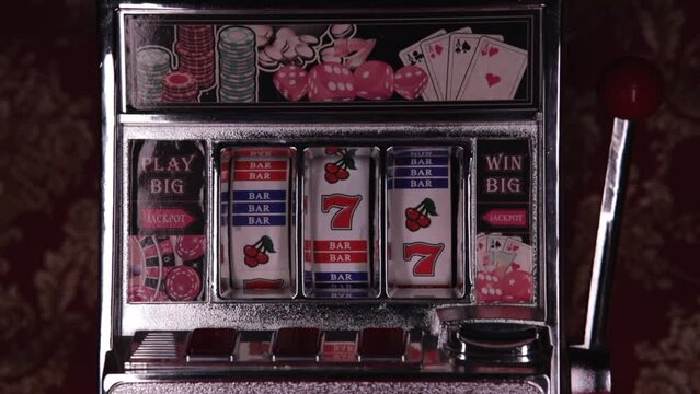 Classic retro casino slot machine spinning winning jackpot closeup loop. One-armed bandit.
