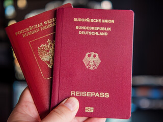 Russian Federation and German Passports Held Together
