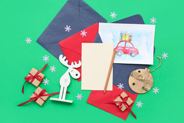 Beautiful composition with Christmas cards on green background