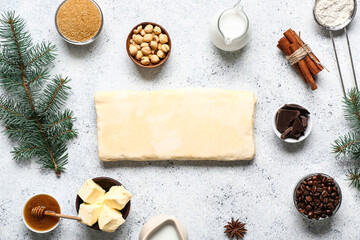 Beautiful composition with different ingredients for preparing Christmas pie on white background
