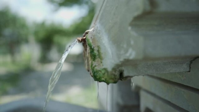 A close-up shot of a thermal mineral spring water source located in the St. Petka memorial shrine, in the town of Rupite, Petrich, Bulgaria.