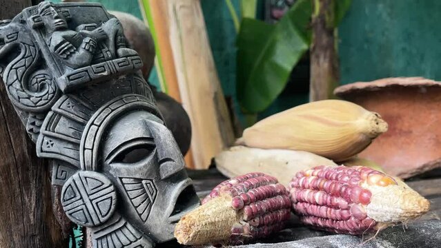 Maya gods sculpture with mais corn as primary source of food in the Yucatan riviera maya Mexico