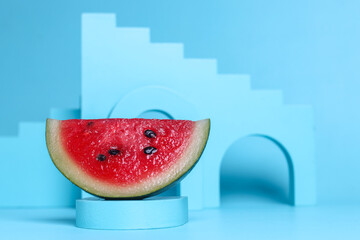 Watermelon slice in blue geometric shape background