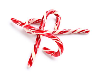 Sweet Christmas candy canes on white background